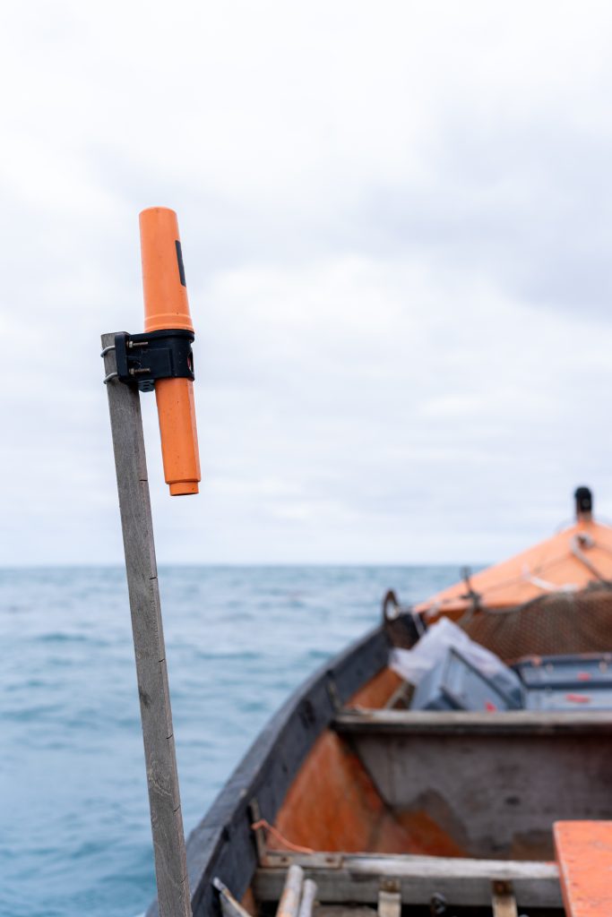 flare attached to a pole next to a boat