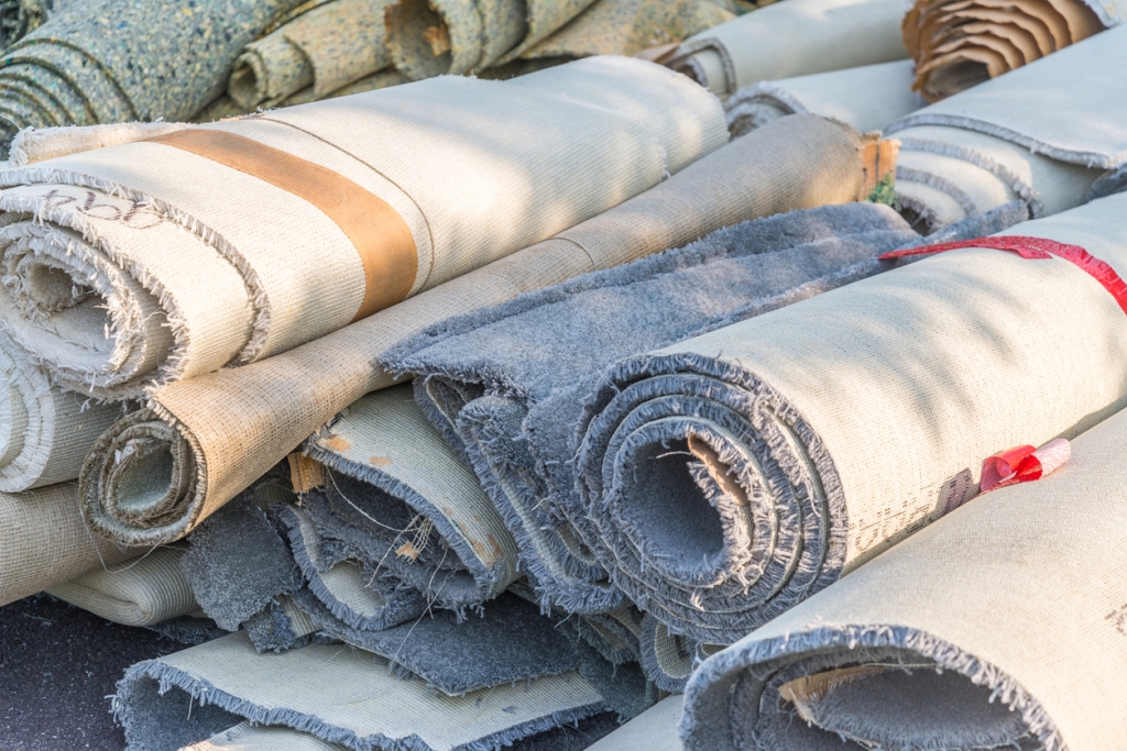 old rugs and carpet rolls